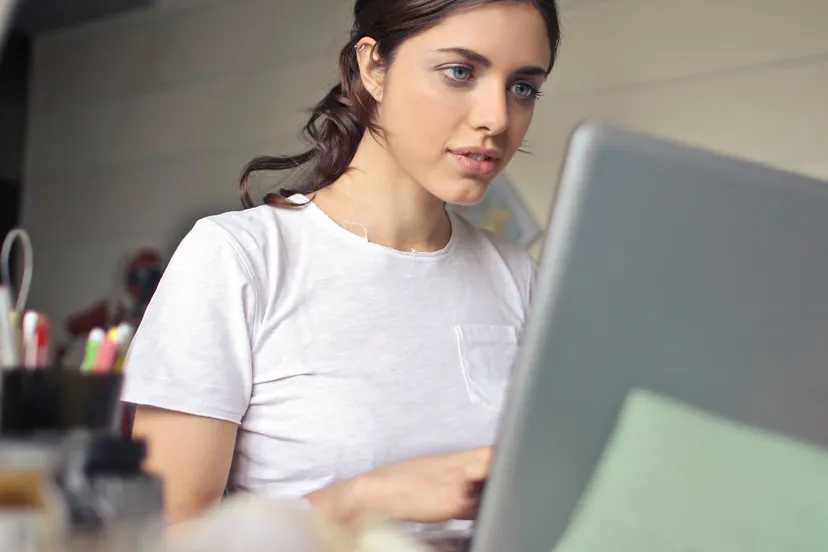 canva photography of a woman using laptop
