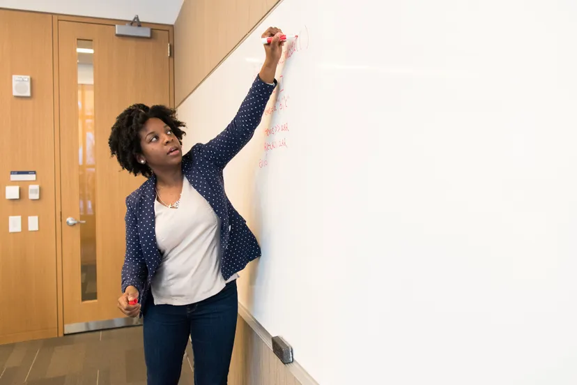 canva woman writing on dry erase board 2