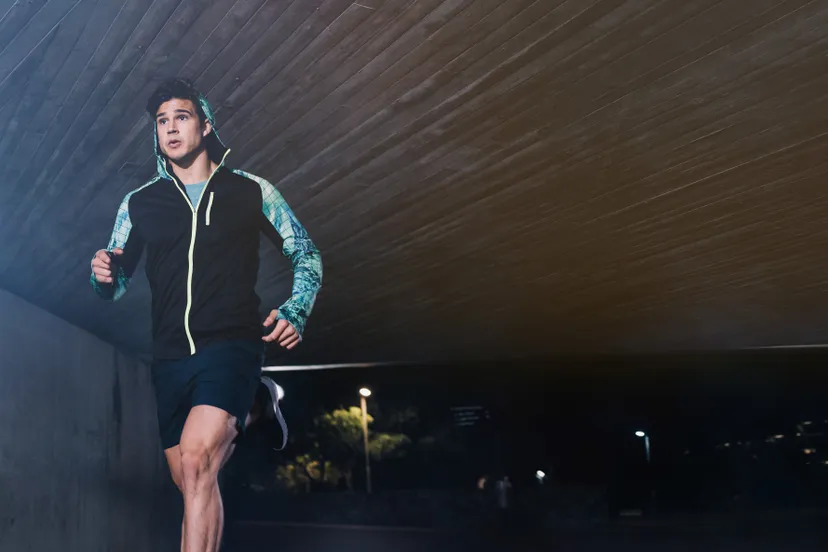 canva young man jogging at night in city 2