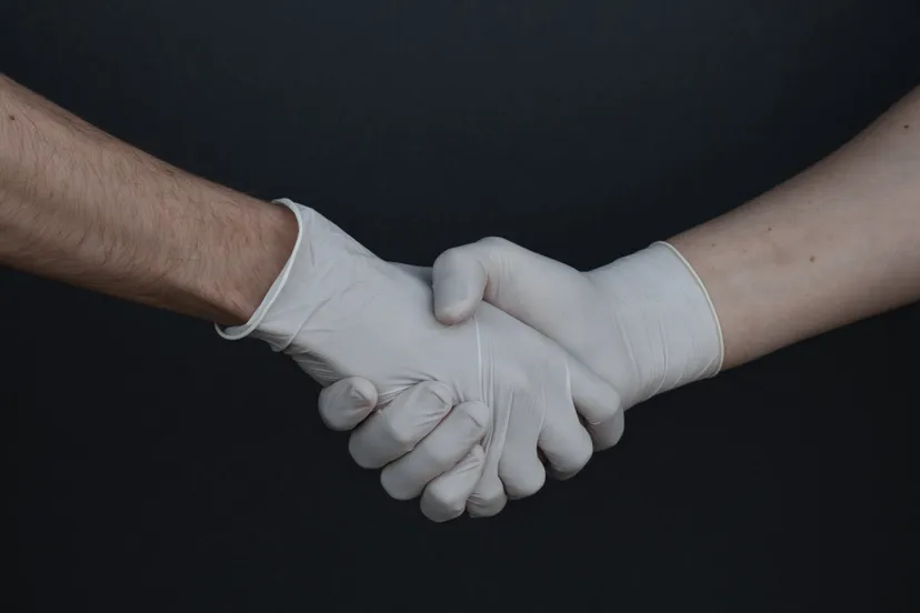 people shaking hands in latex gloves 3959482