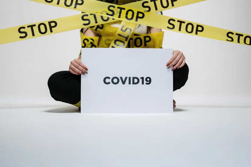 person holding covid sign 3951600