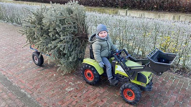 csm_Kind_met_kerstboom_bd445a93c7