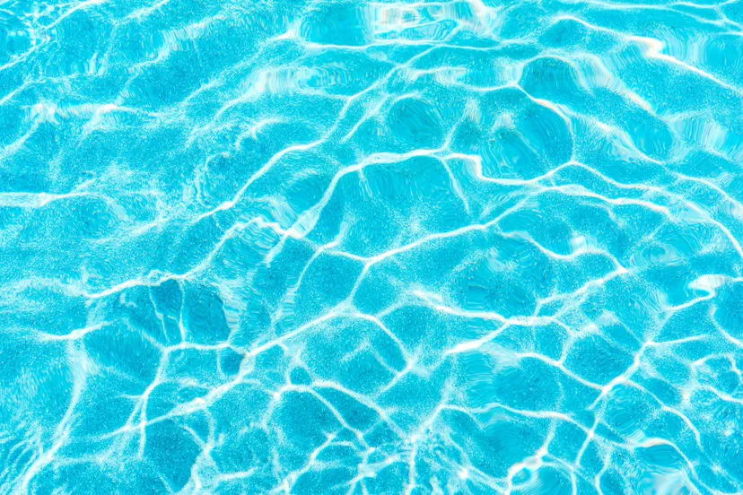 abstract pool water surface and background with sun light reflection