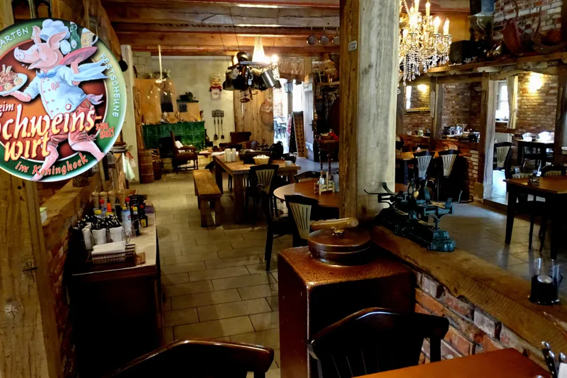 beim schweinswirt im koningshof met logo