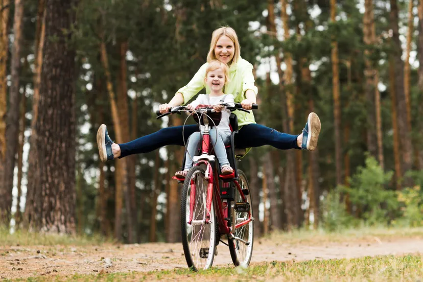 happy mother and daughter on bicycle 1