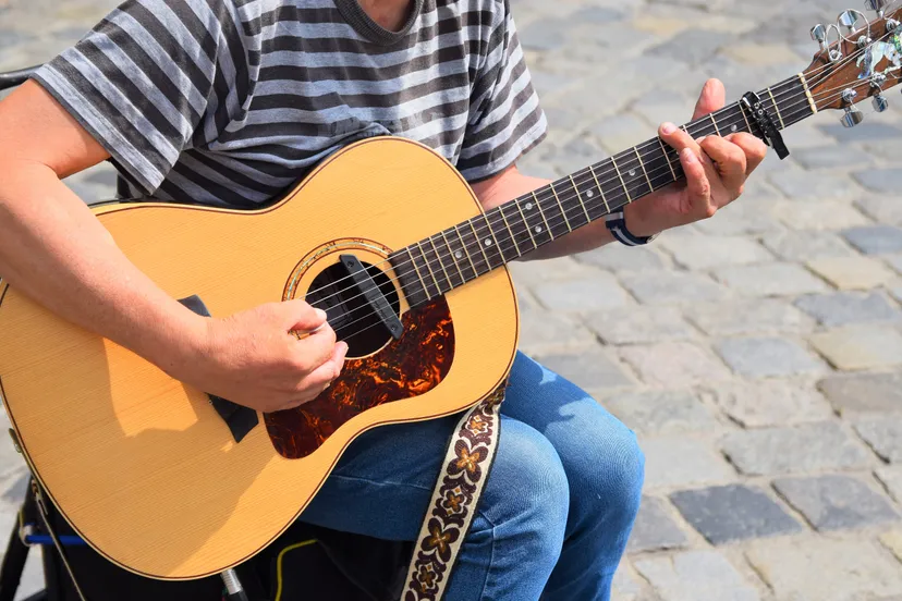 photo of person playing acoustic guitar 2528985