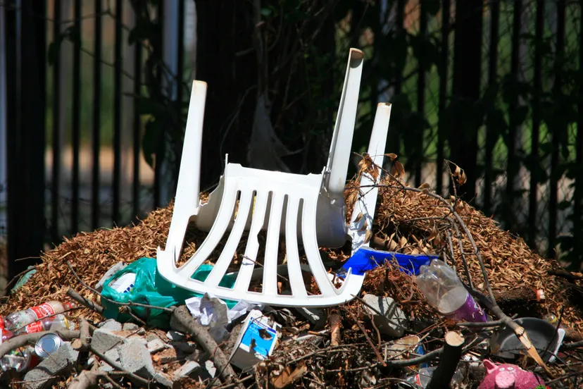chair on rubbish heap