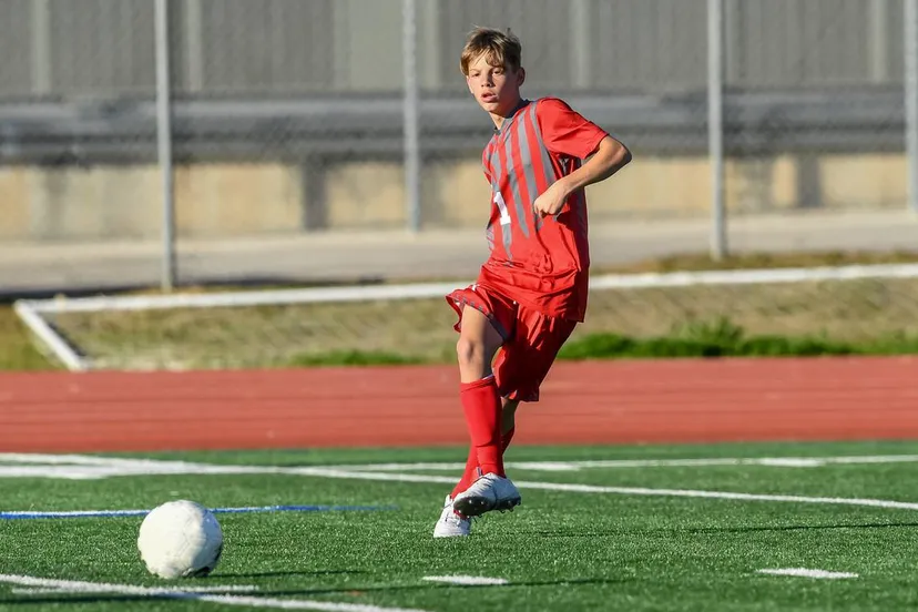 high school boy athlete making amazing plays during a soccer game 1132826201 1147x918
