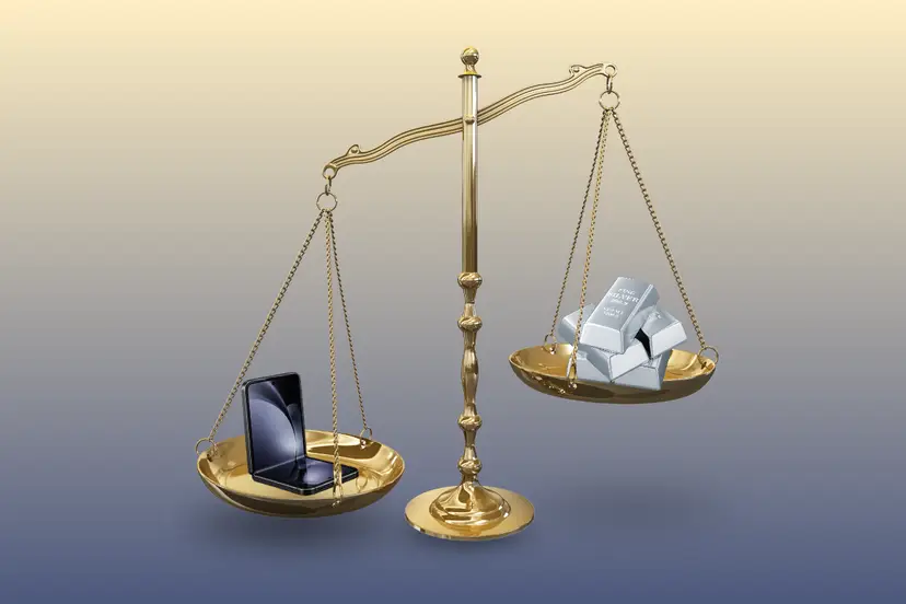 Golden balance scale comparing a black foldable smartphone on one side with stacked silver bars on the other.