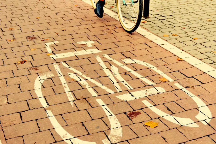 woman-riding-bicycle-path-centre-city