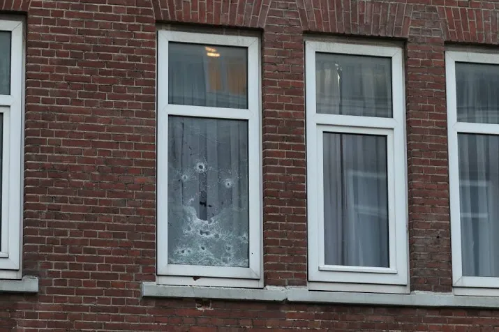 huis rotterdam beschoten bewoner aangehouden