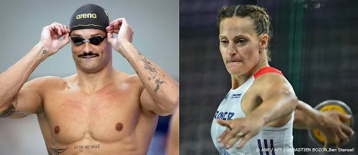 robert michon en manaudou dragen franse vlag tijdens opening os