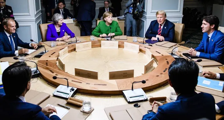 vrolijke trump en trudeau op g7