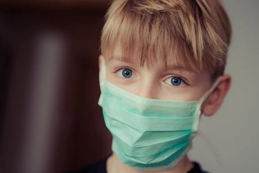 boy wearing surgical mask 695954