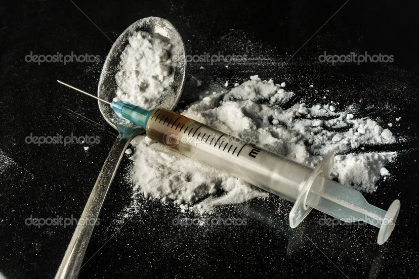 depositphotos 22923468 stock photo drug syringe and cooked heroin