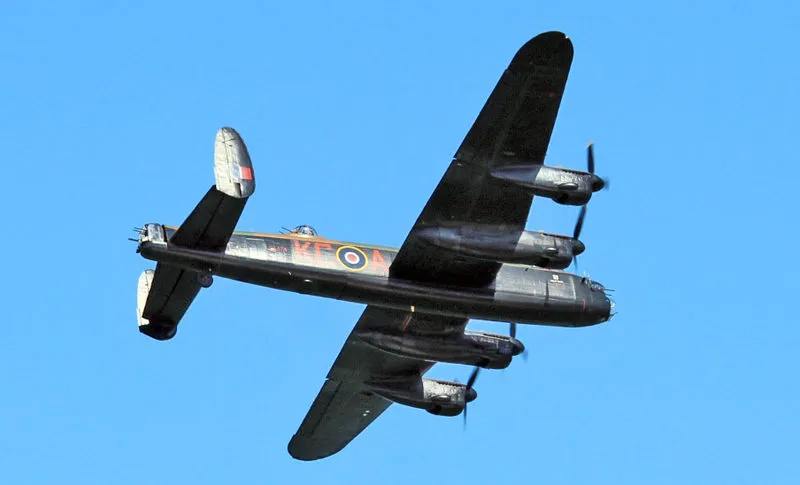 800px lancaster bomber over cowes in may 2013 5 geoff acton wikimedia