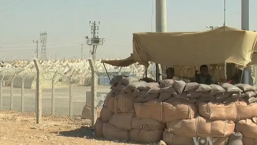 syrian refugee center with soldiers protecting