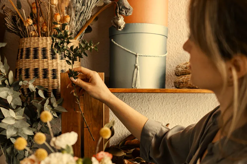 woman making beautiful floral arrangement