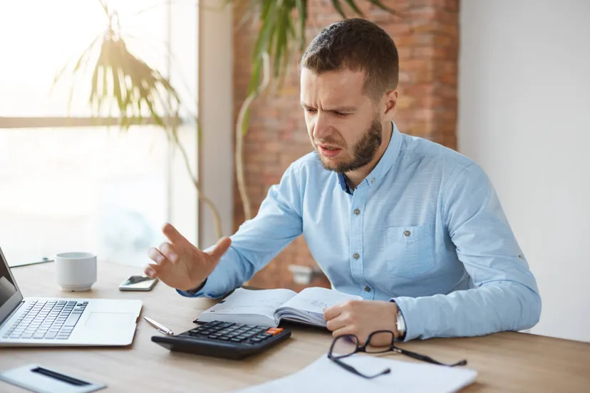 portrait unhappy mature bearded accountant working company office