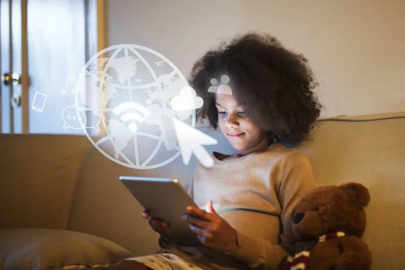 young black girl using digital tablet