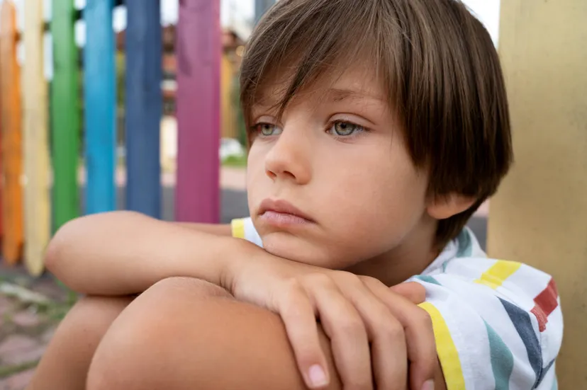 side-view-sad-boy-park