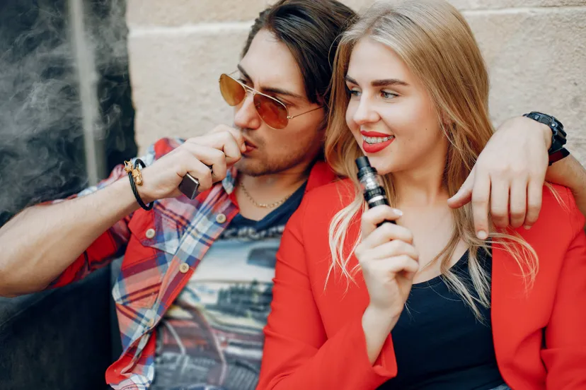 stylish-young-couple-with-vape-cafe