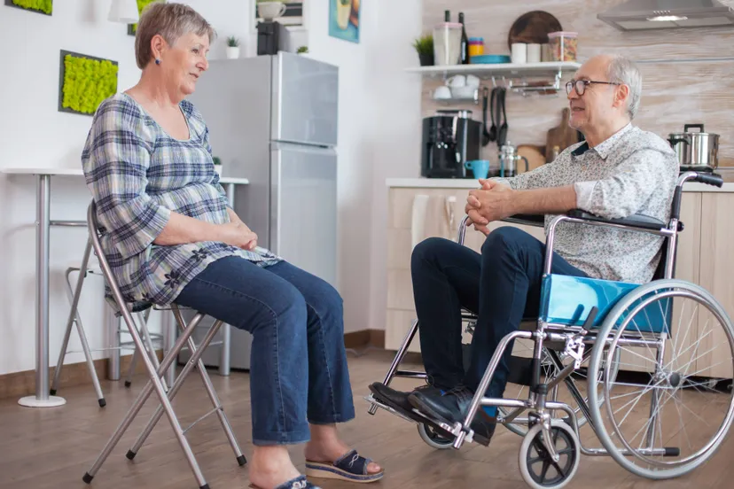 old-woman-her-disabled-husband-wheelchair-chatting-kitchen-elderly-person-having-conversation-with-husband-kitchen-living-with-disabled-person-with-walking-disabilities