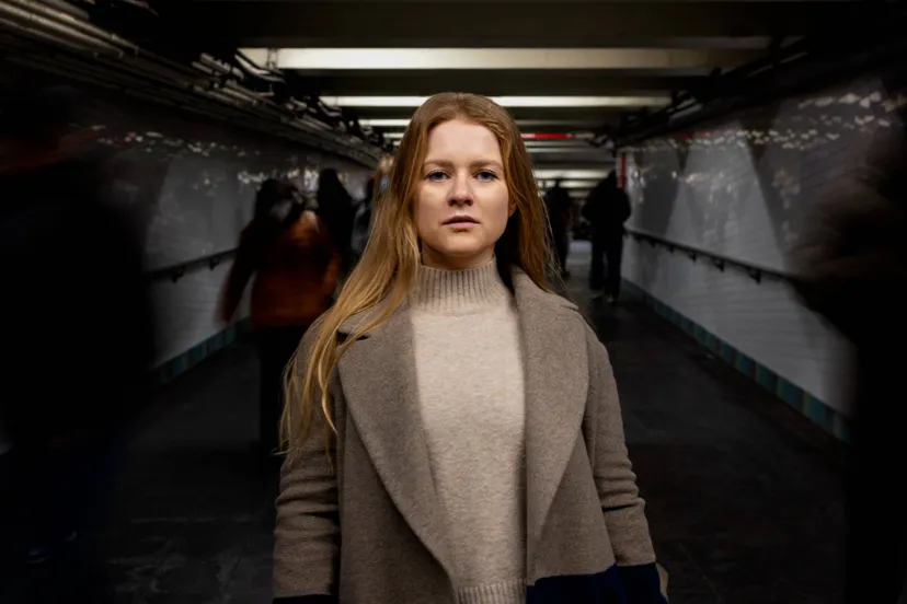 woman-posing-while-traveling-city-subway