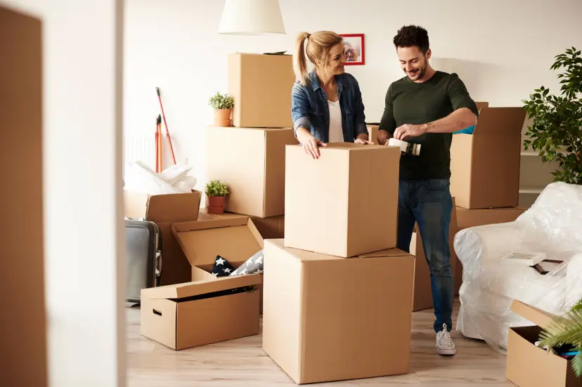 couple-packing-stuff-plenty-cardboard-boxes