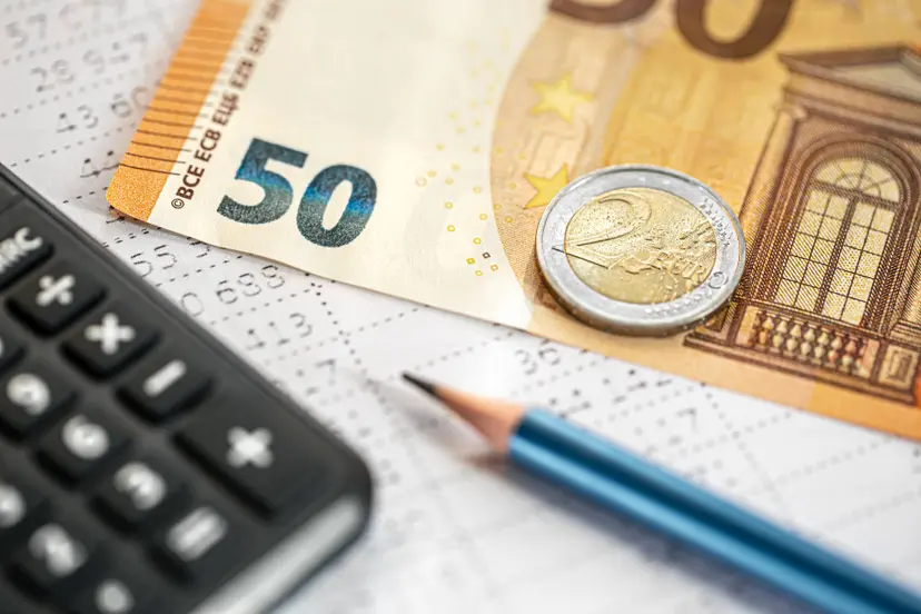 calculator-money-pencil-closeup-blurred-background