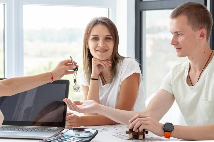 front-view-couple-accepting-keys-their-new-house