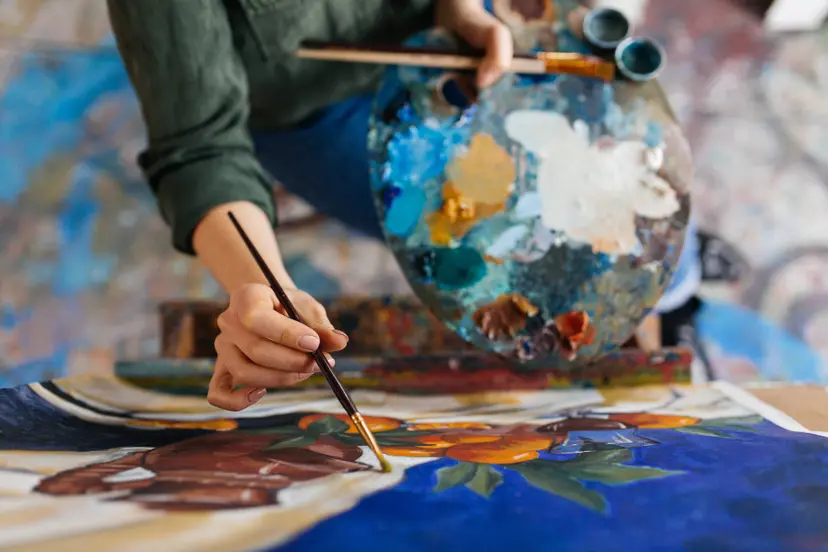 top-view-attractive-woman-hands-drawing-amazing-picture-canvas-modern-cozy-art-workshop