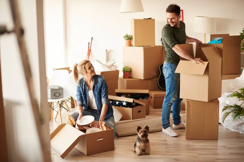young-couple-new-apartment-with-small-dog (1)
