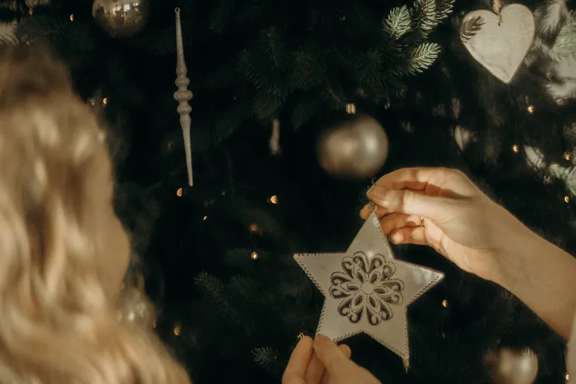 girls putting ornaments on a christmas tree 3154328 e1575971625492