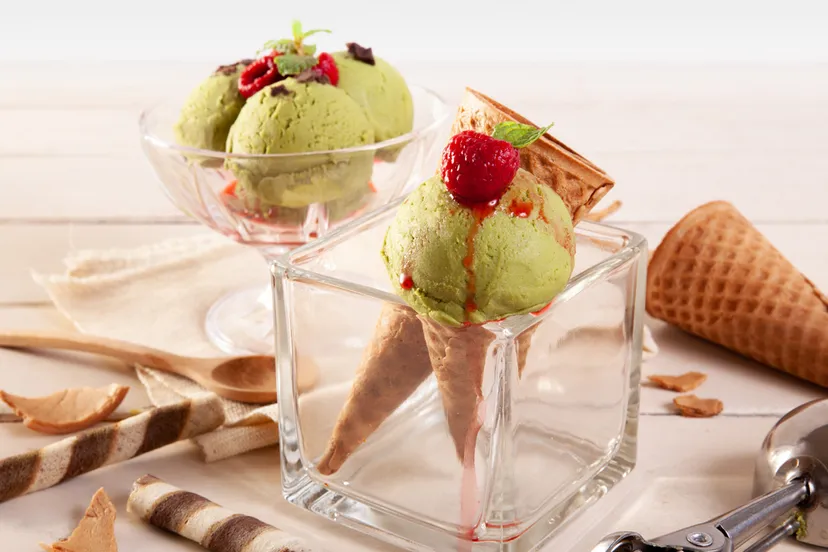 green ice cream glass sprinkled with lasagne chocolate wooden table