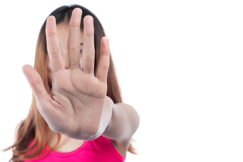 woman making stop gesture with her hand