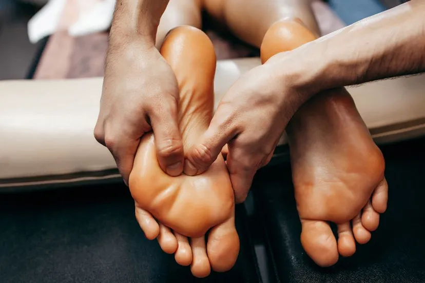 doctor podiatrist does examination massage patient s foot clinic