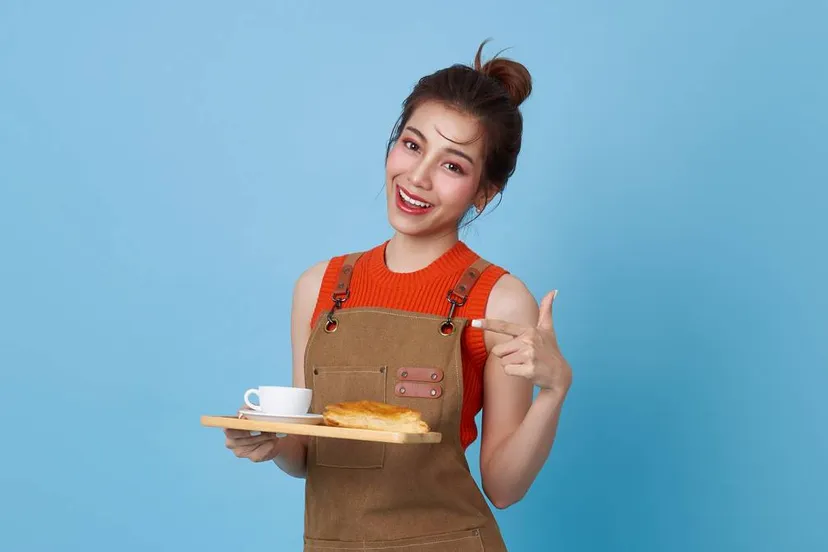 happy barista asian woman serving customer holding coffee cup coffee shop