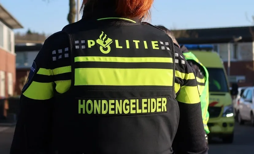 politie hondengeleider stock