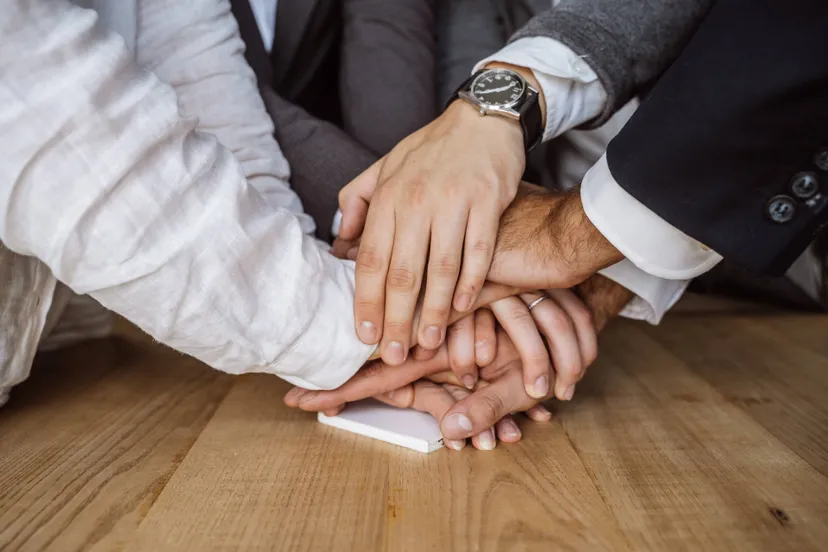 united-hands-business-team-workspace-background