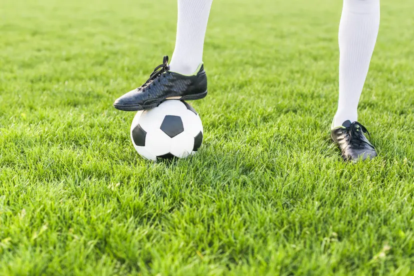 amateur-football-concept-with-man-posing-with-ball