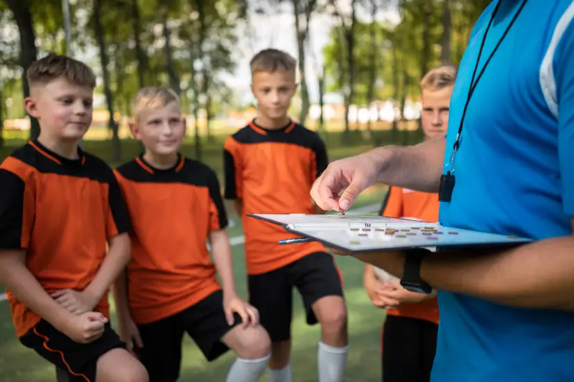 football-trainer-teaching-his-pupils