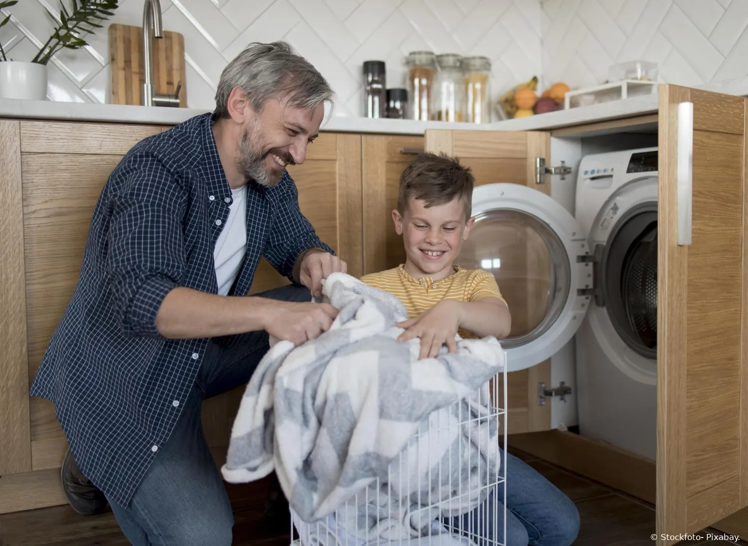 medium shot father kid doing laundry