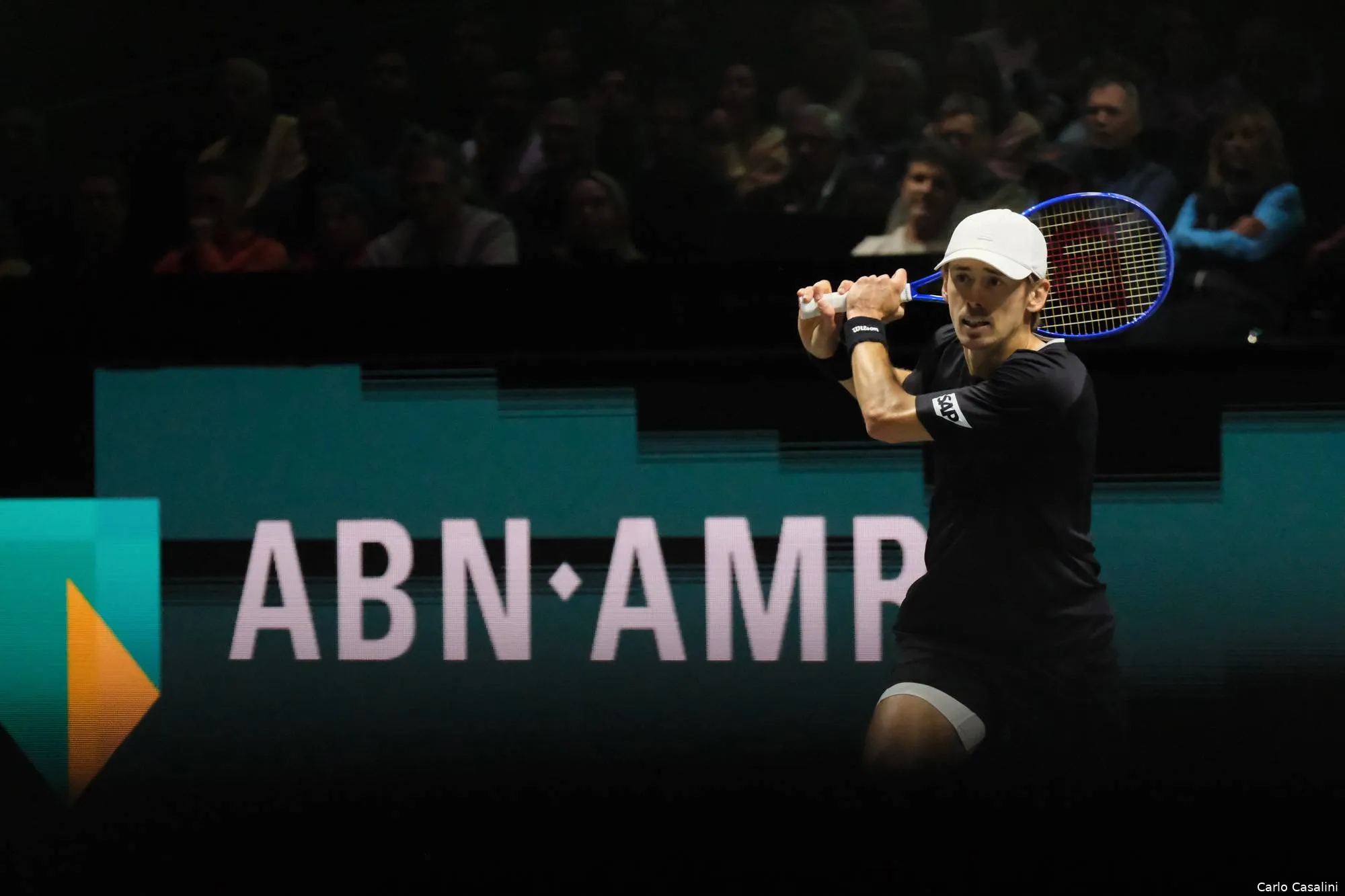 Alex de Minaur returns.