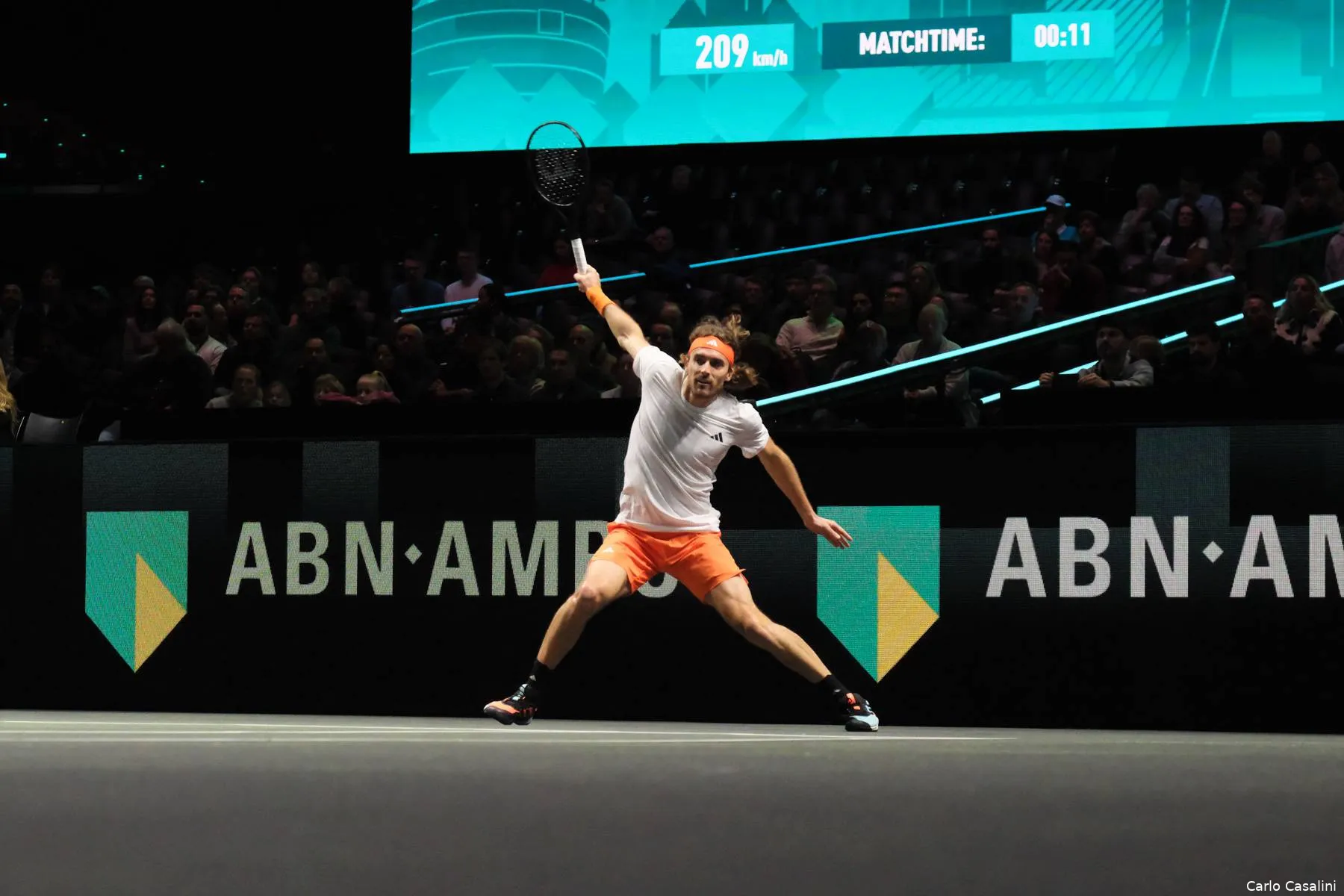 Stefanos Tsitsipas swats forehand.