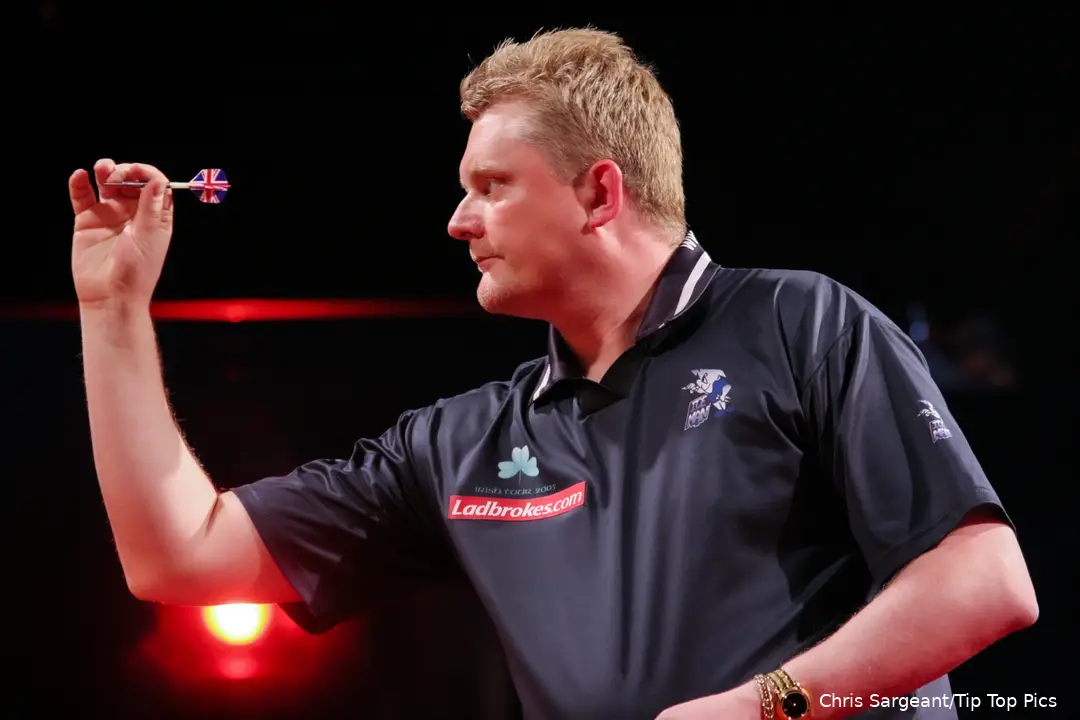 Alan Warriner-Little throws darts.