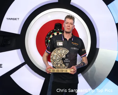 Jimmy van Schie poses with the WDF World Championship title