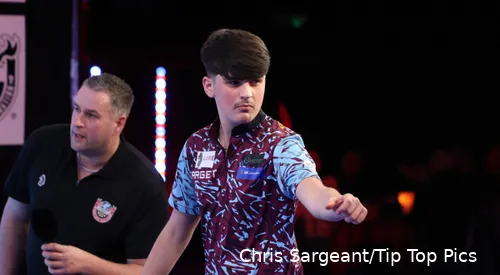 Kaya Baysal pumps his fist toward the crowd.