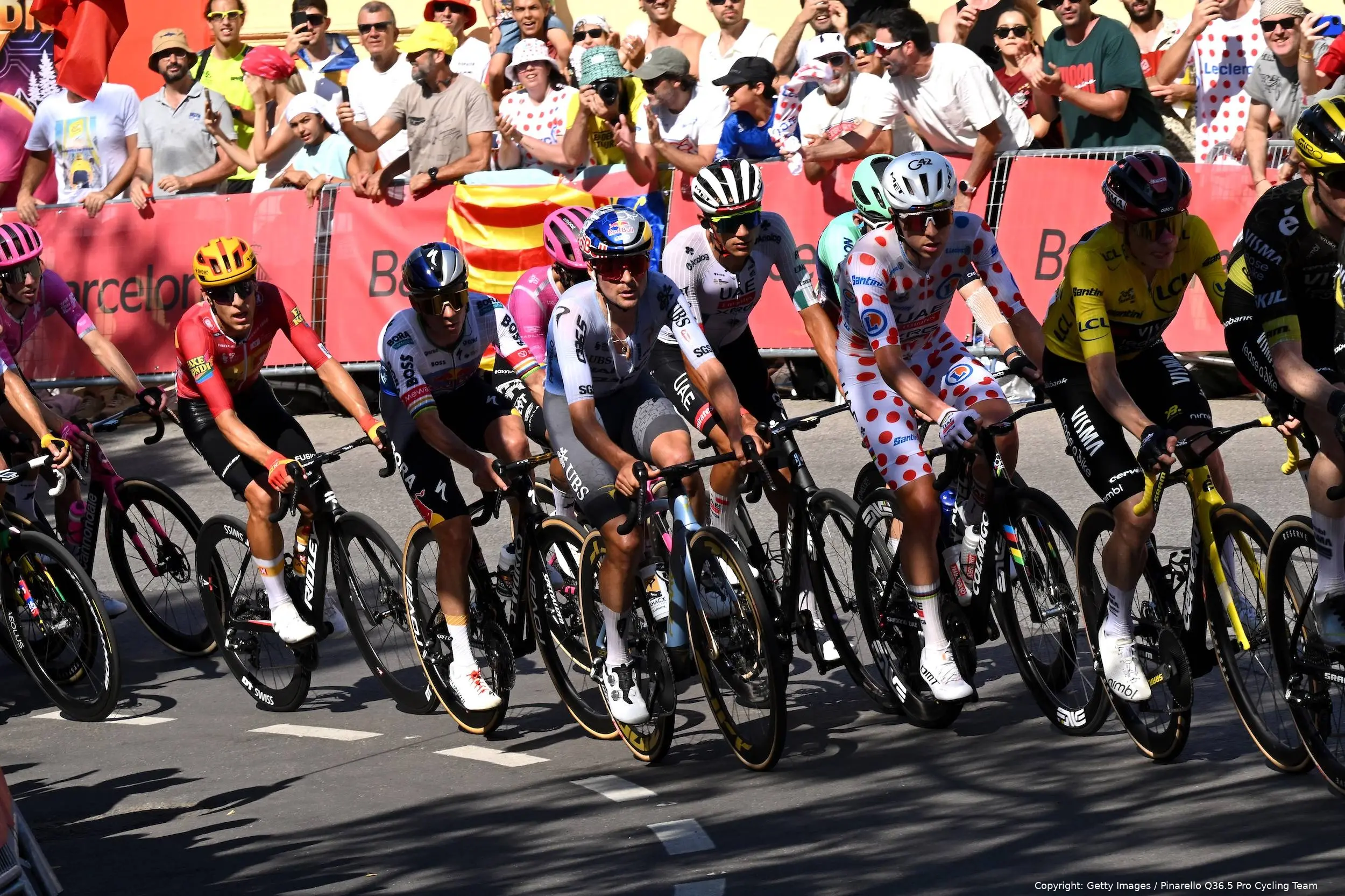 Tom Pidcock riding alongside Tadej Pogacar on stage 2 of the 2026 Tour de France
