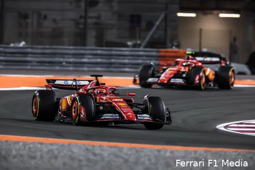 Charles Leclerc leads Carlos Sainz in Ferrari cars during the 2024 Qatar Grand Prix on a brightly lit night track.